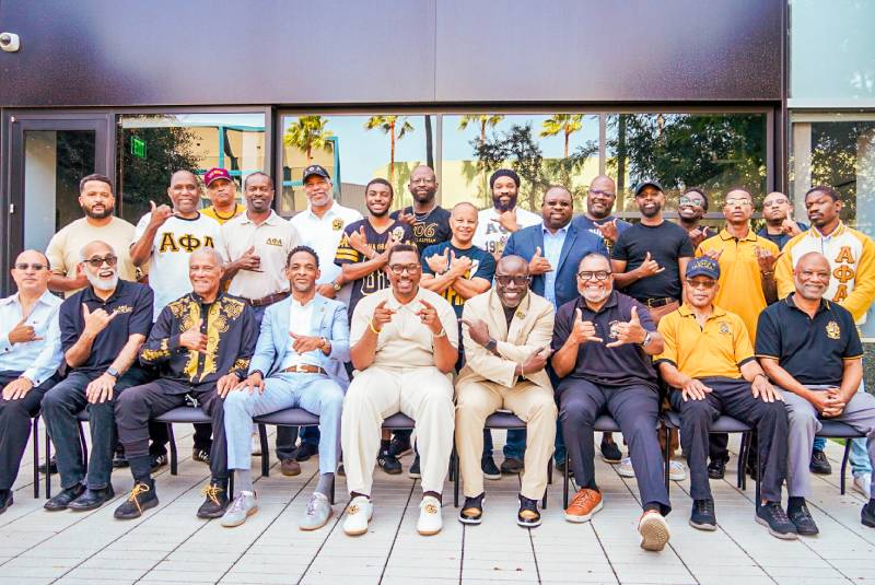 Brothers of Beta Psi Lambda gathered for a group photo